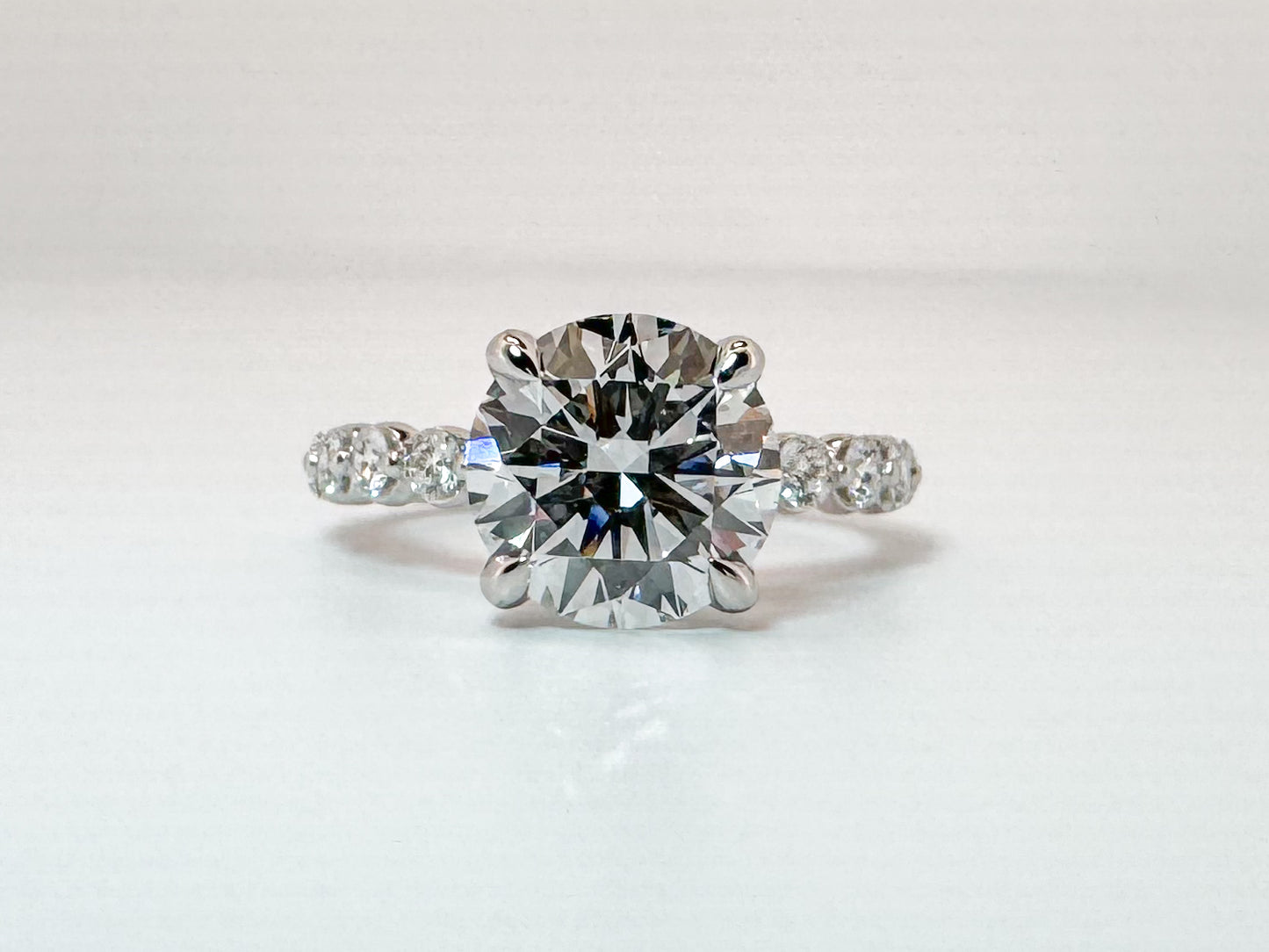 14k, White gold 3.00 carat center VS1 E Ideal cut, set with .55 carats of side diamonds. IGI certified