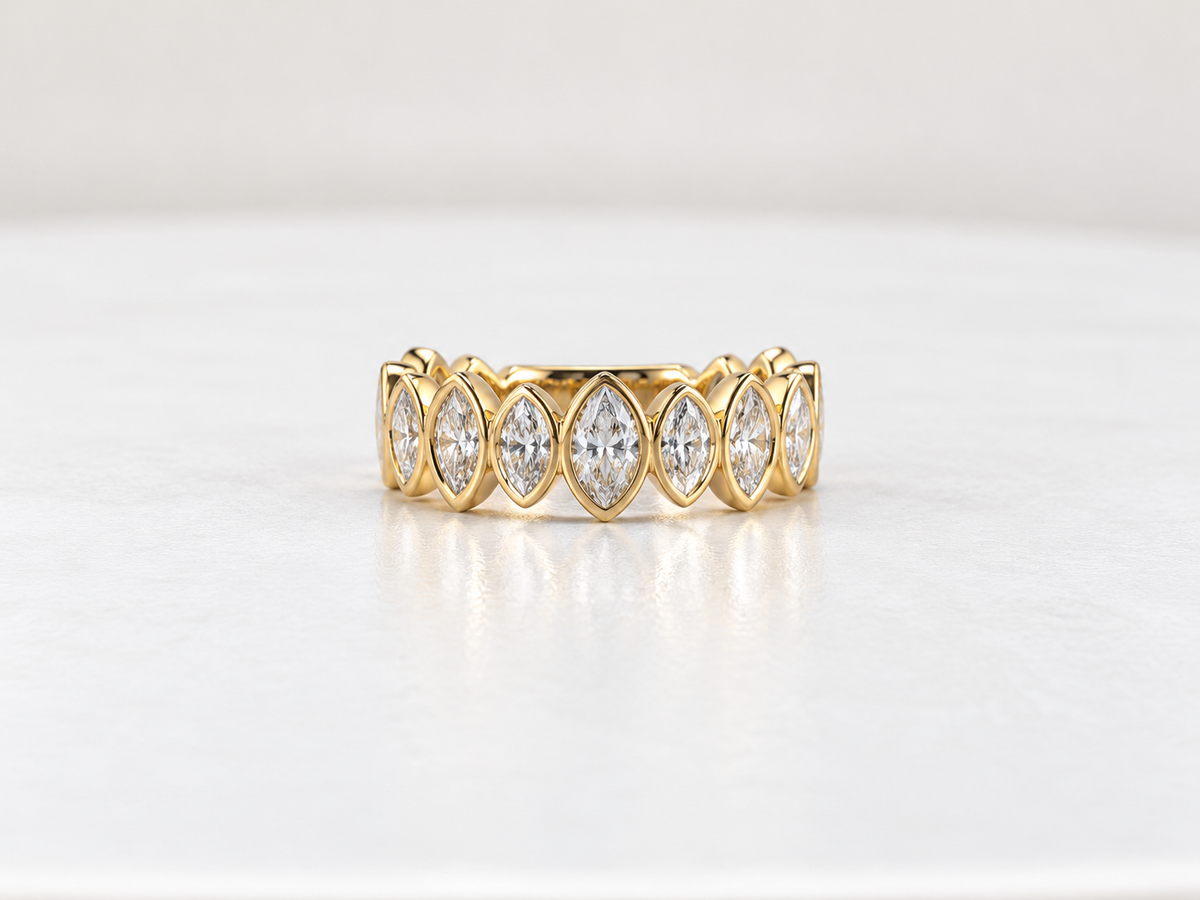14K, Yellow gold, .65 diamond total weight, marquise diamond band. Lab grown
