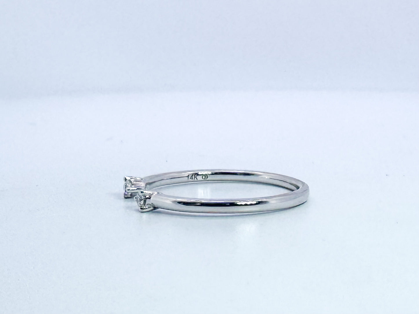 14k, white gold, .05 diamond total weight, open concept band.