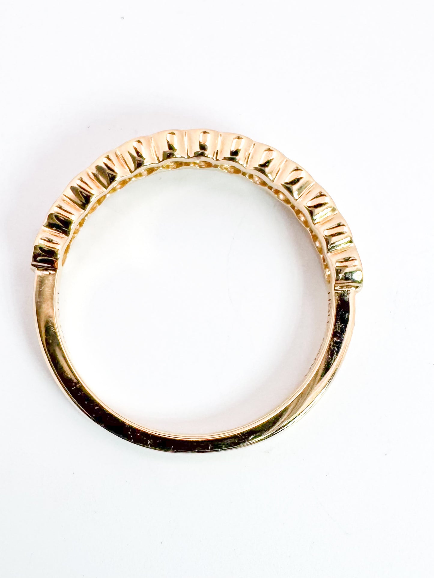 14k, Yellow gold .50 dtw half bezel diamond band.