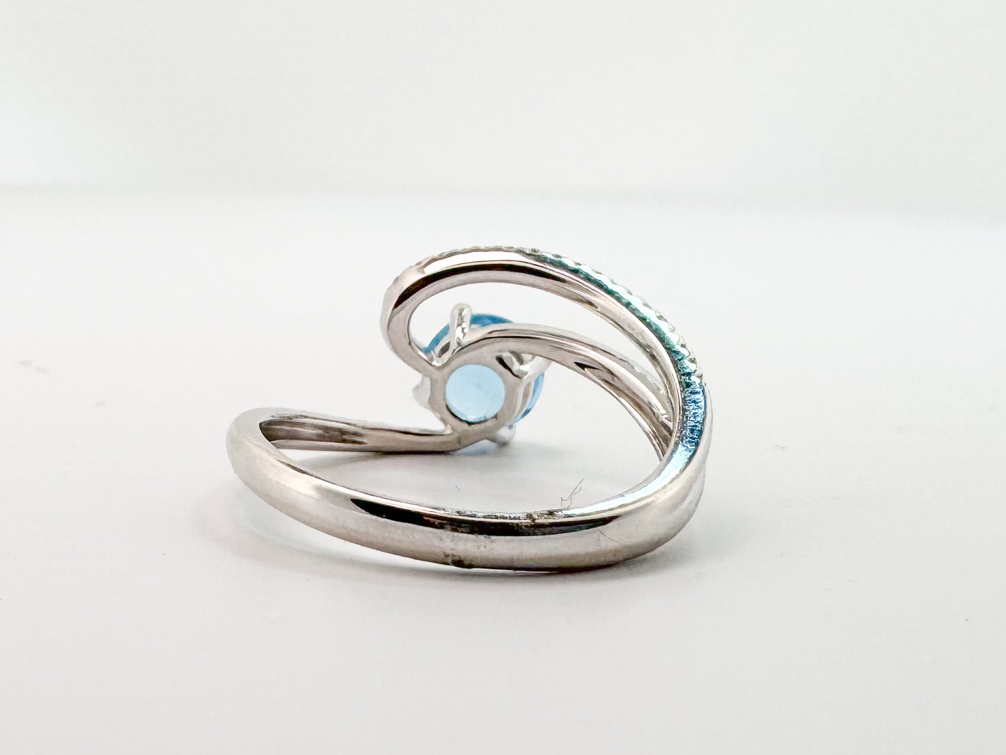 14K, white gold, 1.00 CT Blue topaz with .10 side diamonds fashion ring.
