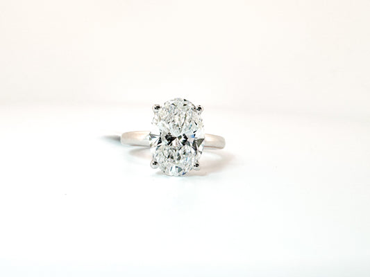 14k, White gold solitaire, set with 4.02 carat lab grown oval diamond. GIA Certified. VS1 E