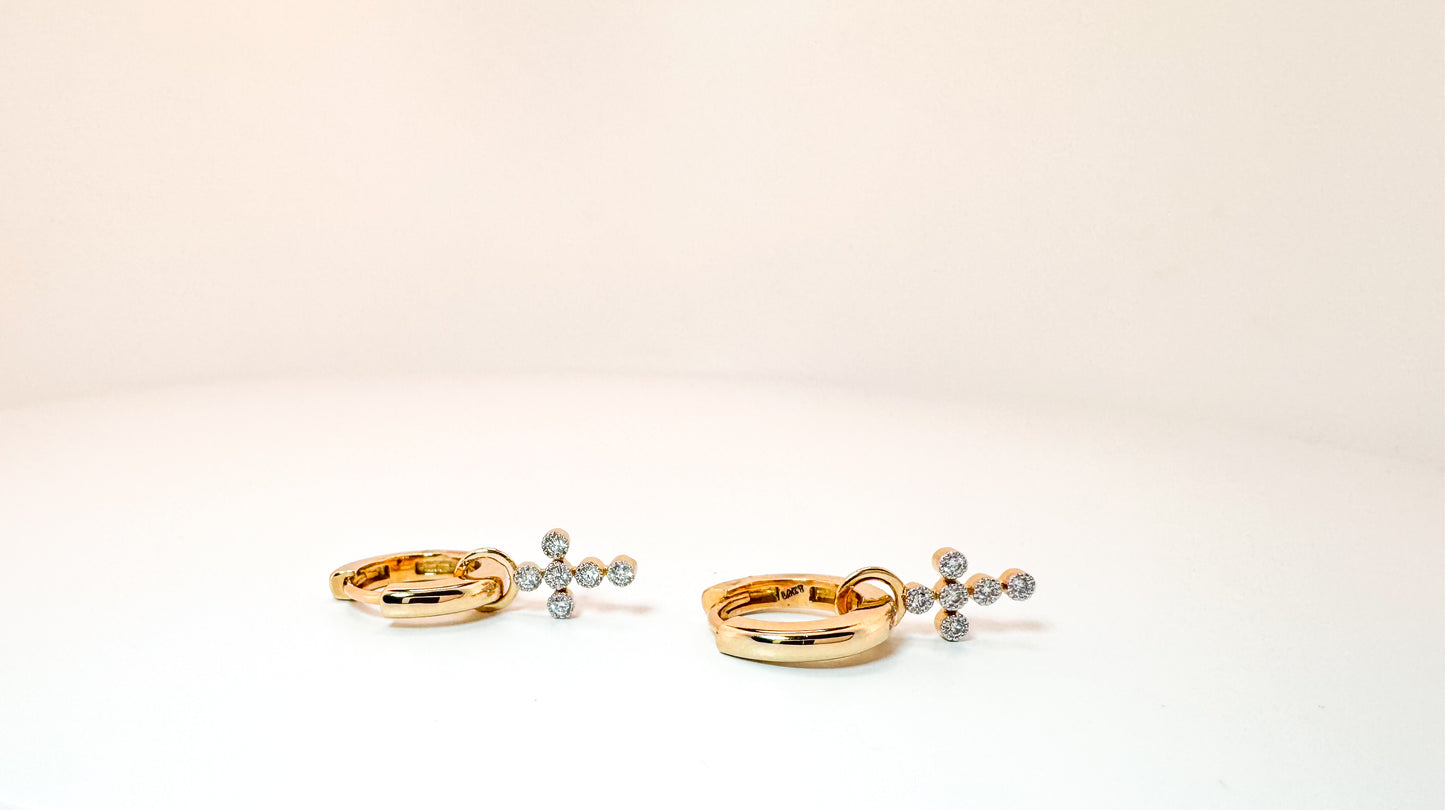 14K, yellow gold, .14 diamond total weight. cross  lab diamond earring
