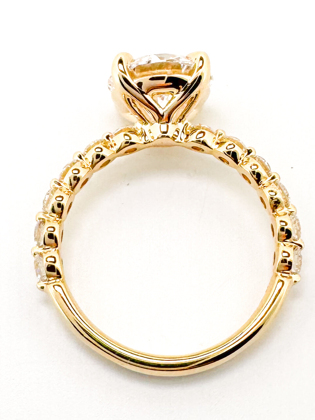 14K, Yellow gold 3.05 lab grown round brilliant engagement rint with .53 carats of side diamonds. IGI cert