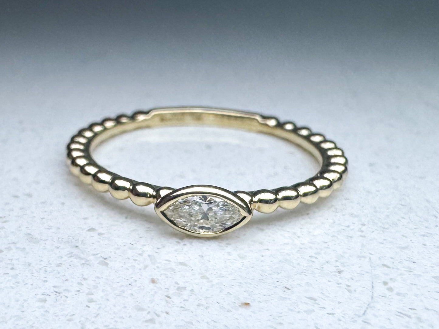 14k yellow gold beaded .14ctw side ways marquise fashion ring