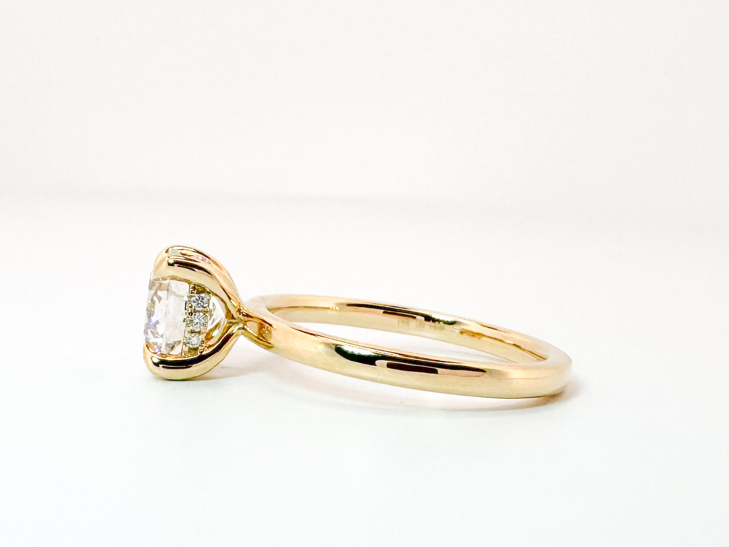 14k, Yellow gold , 1.59 E VS2 Ideall cut, lab grown, round brilliant  set with .07 side diamond halo. IGI Certified