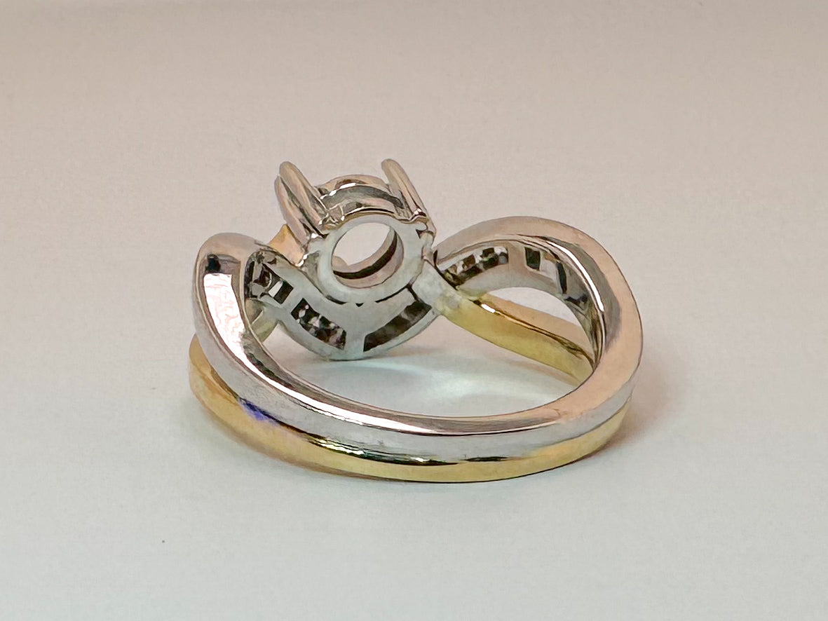14K,two tone, .25 natural side diamond engagement mounting. Holds 1.00 carat round center stone
