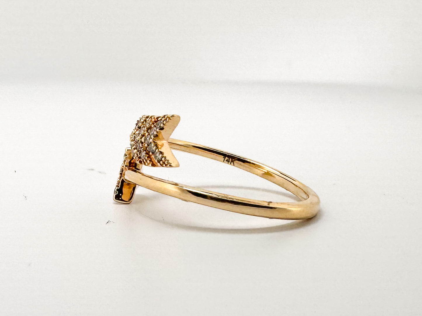 14K, Yellow gold, natuiral diamond aarow fashion ring. .10 carat total weight.