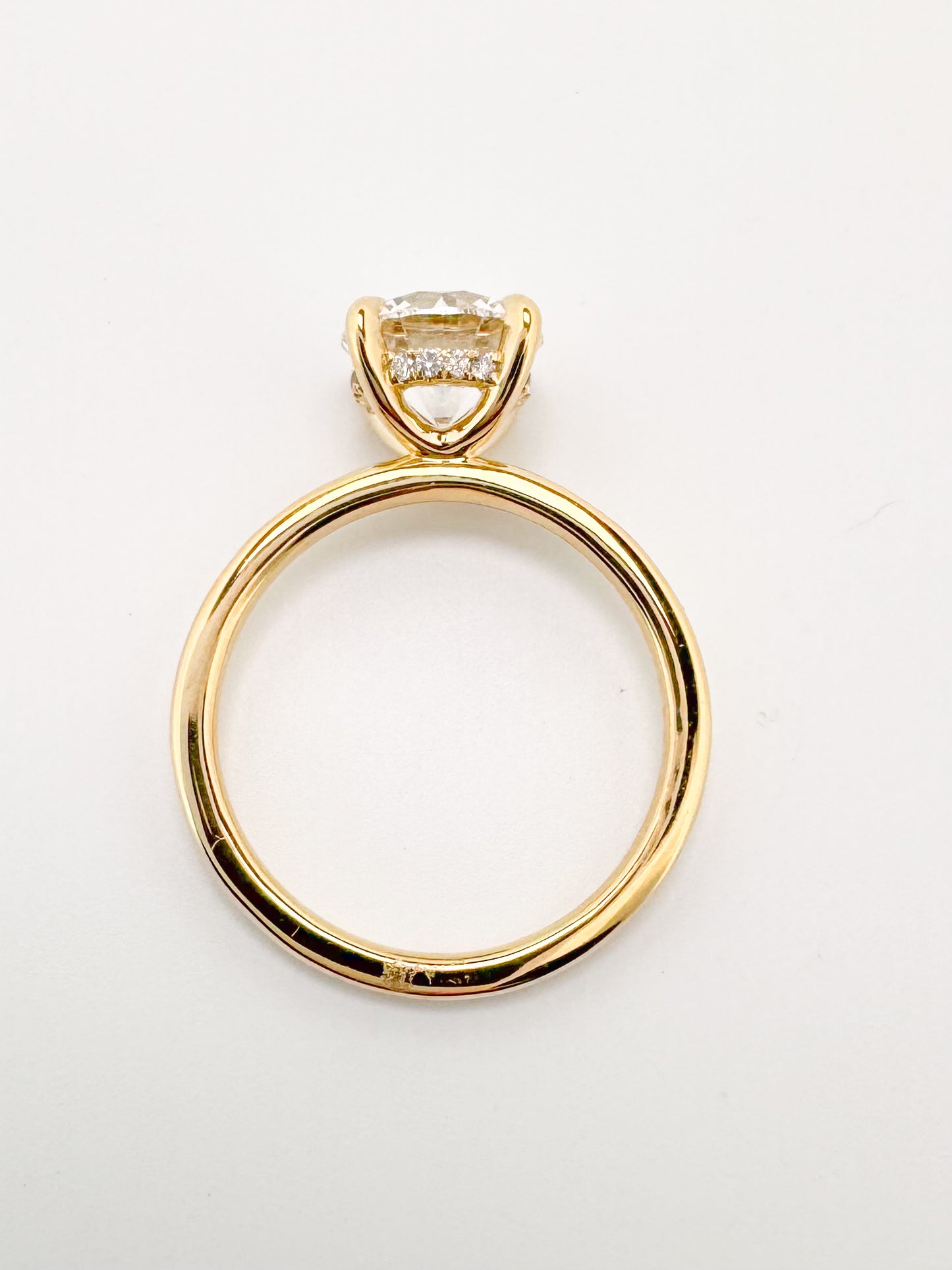 14K, Yellow gold 2.09 carat Ideal cut, round brilliant, set with .08 hidden halo side diamond. IGI certified