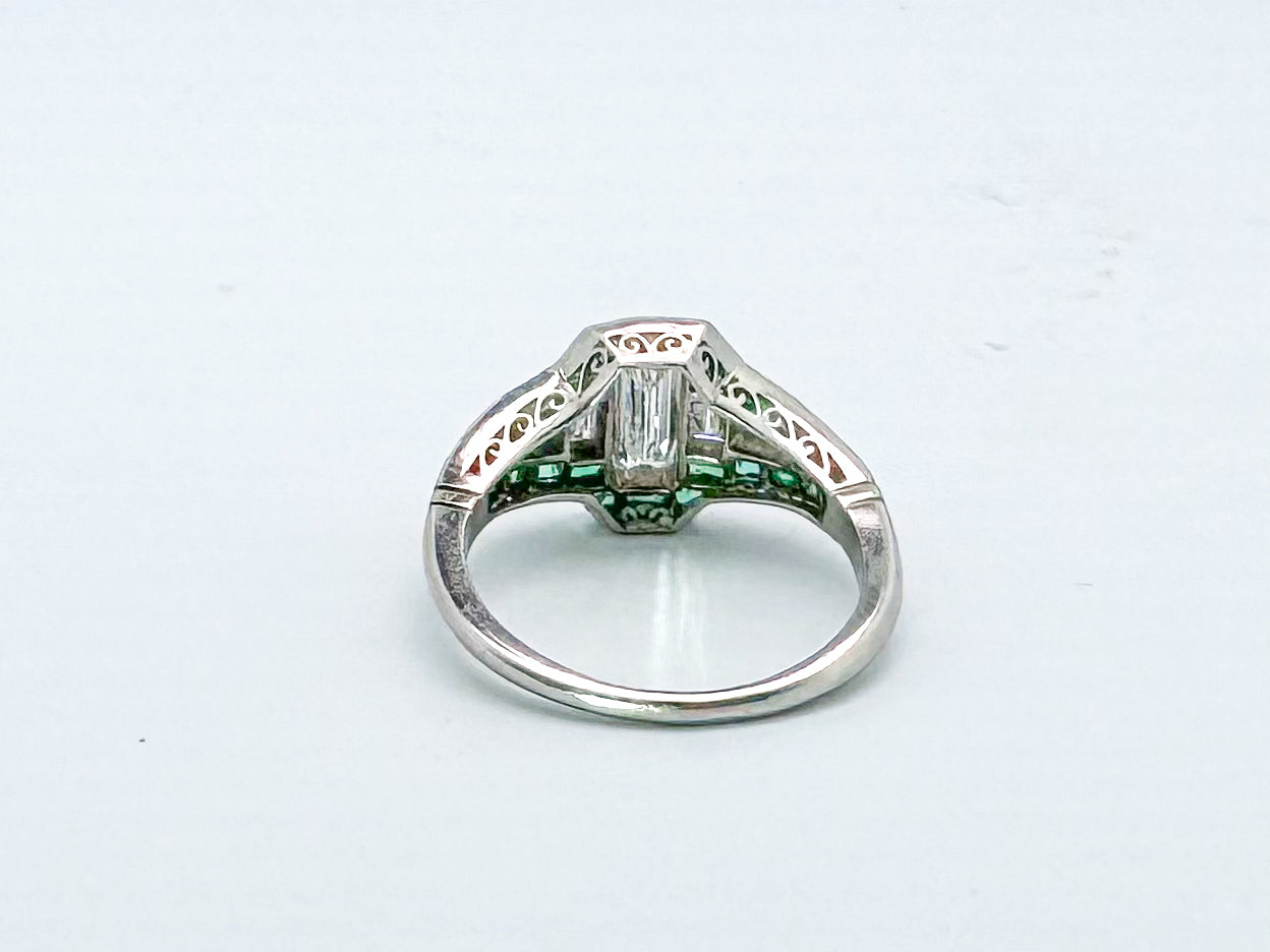 VINTAGE, Platinum .58 Natural emerald cut diamond set with .38 side diamonds and Natural Emeralds