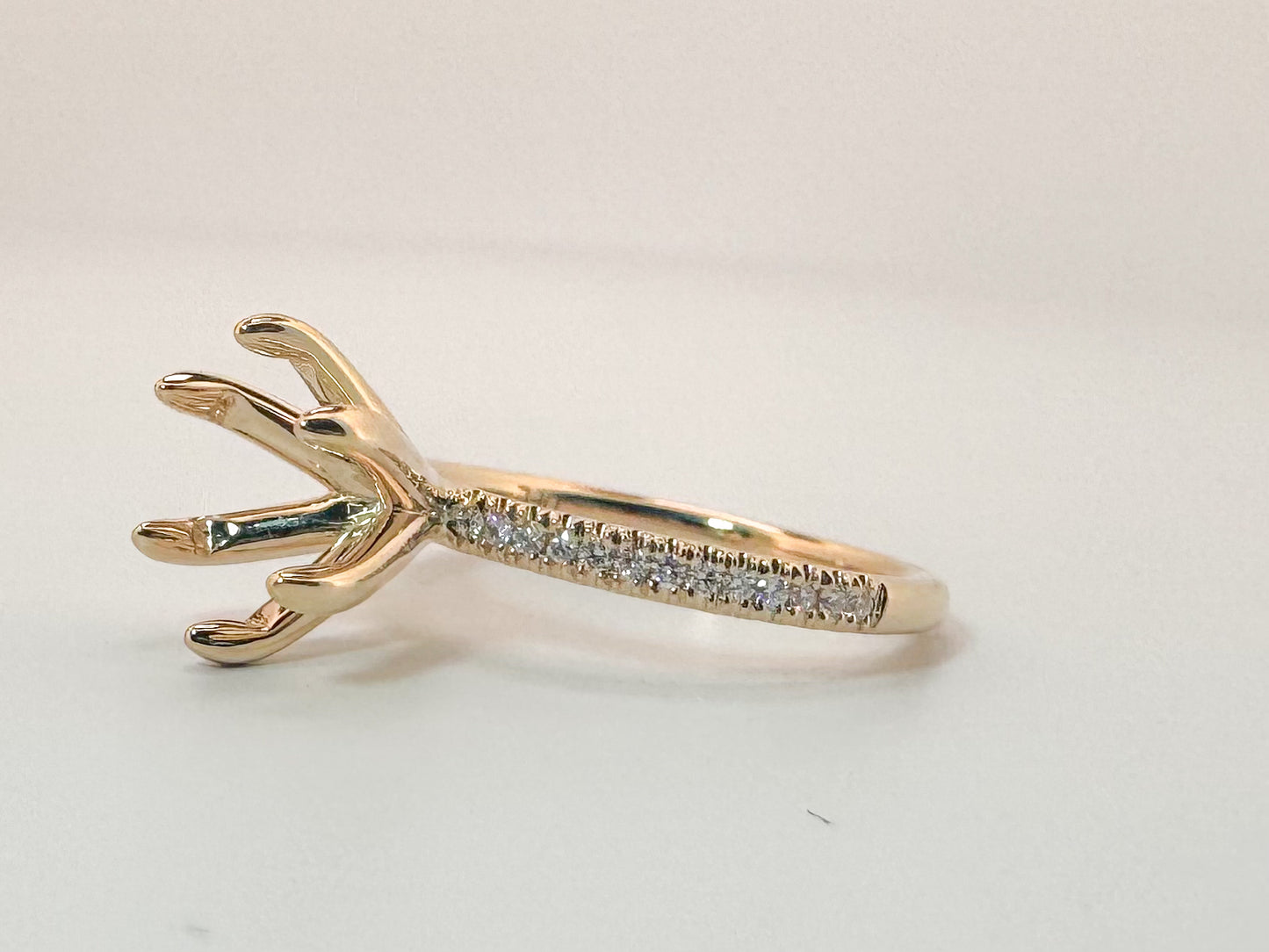 14K, yellow gold .13 side diamond total weight, Semi mount to hold 8mm stone.