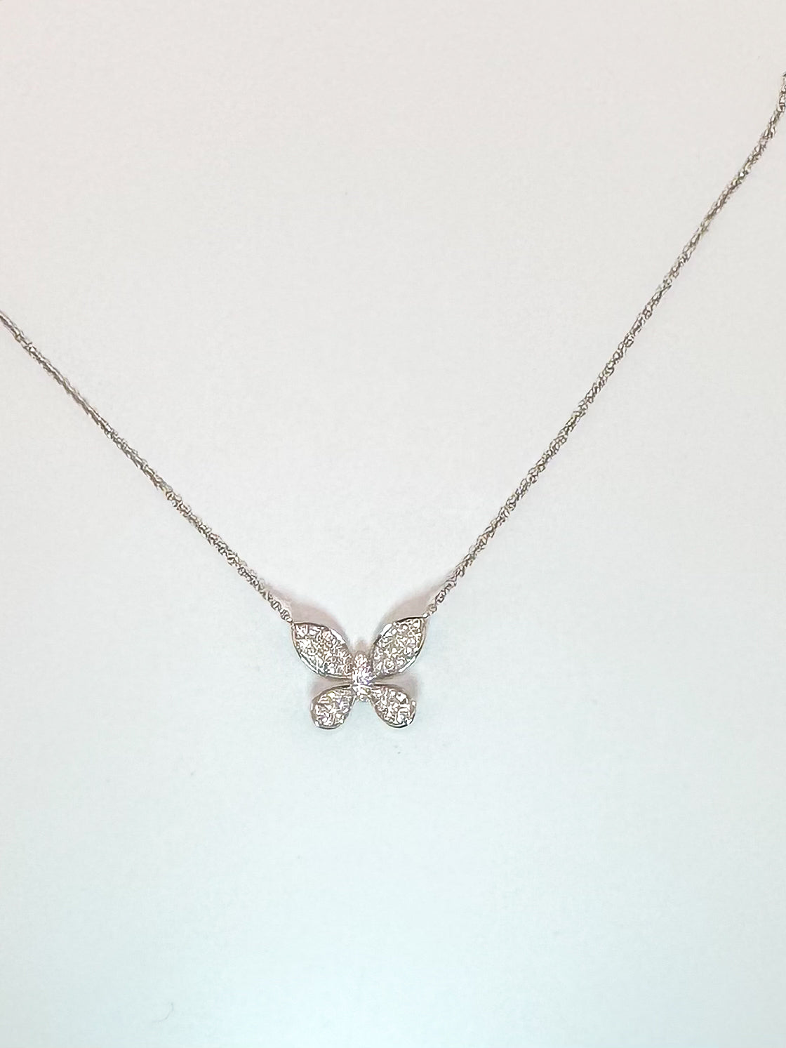 14k, White gold .38 diamond total weight butterfly pendant.