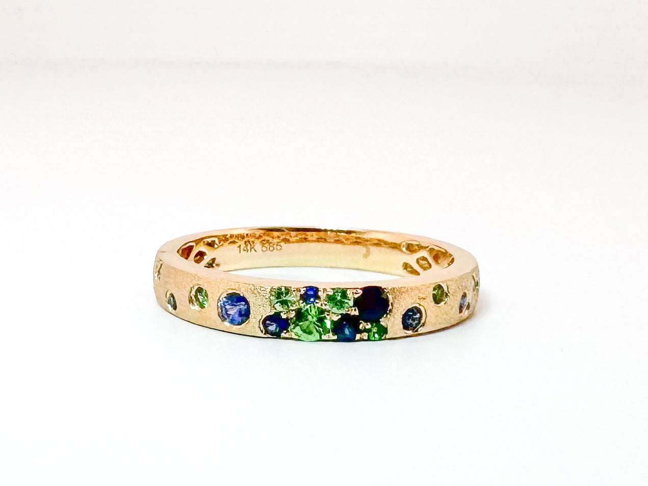 14K, Yellow gold, sapphire and tsavorite garnet fashion band. .37 carat total weight.