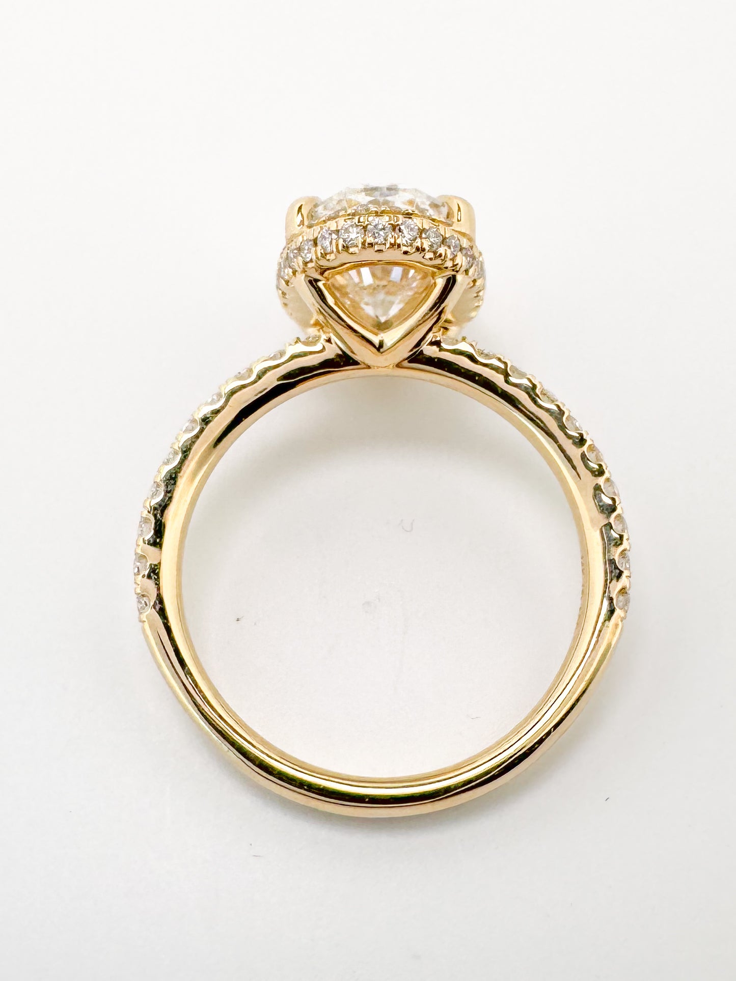 14K, yellow gold, 3.04 carat, Oval lab grown , VS2 F set with .44 carats of side diamonds. IGI certified