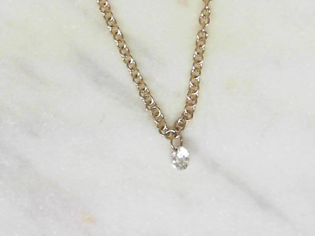Drilled diamond floating pendant