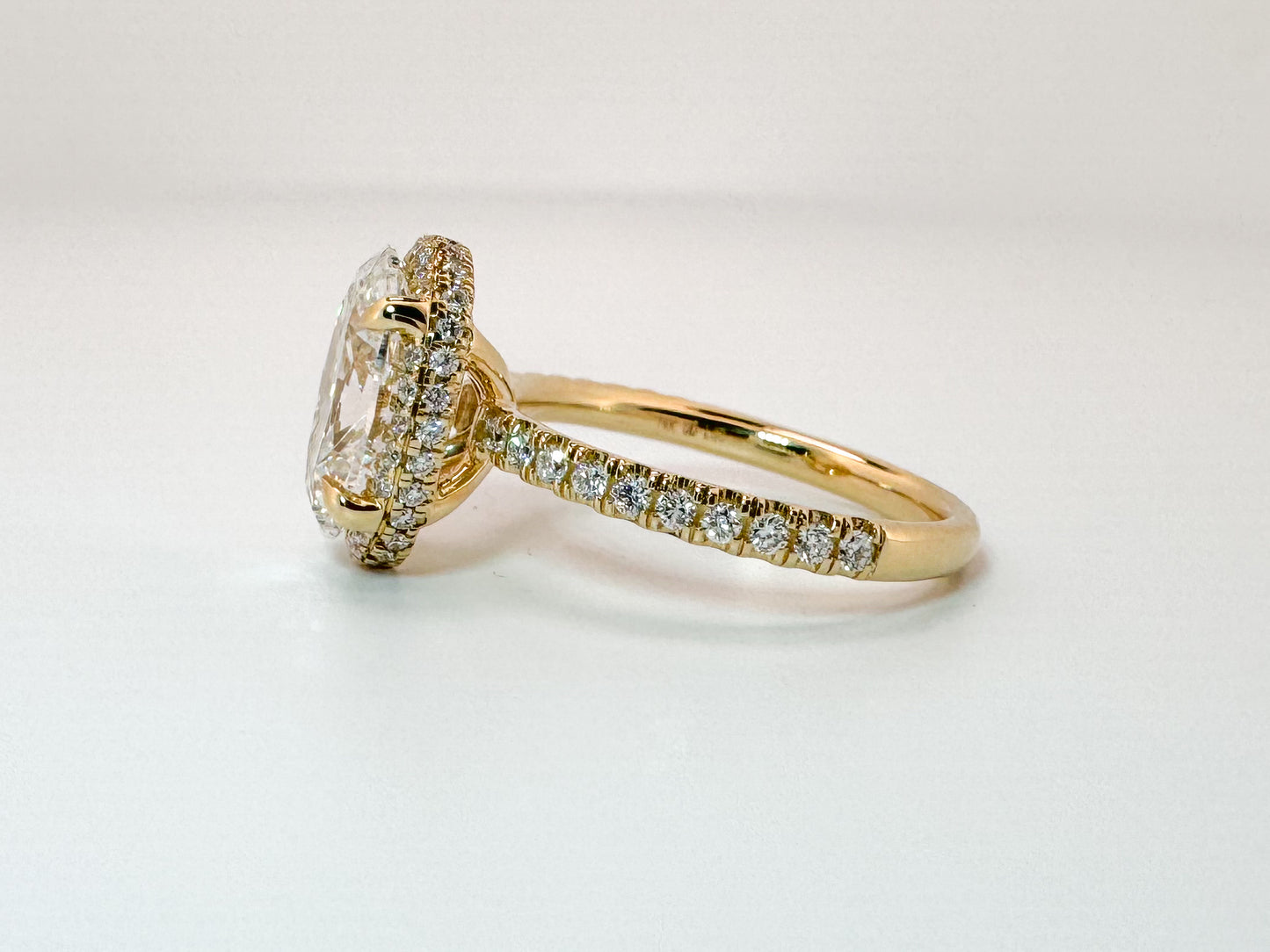 14K, yellow gold, 3.04 carat, Oval lab grown , VS2 F set with .44 carats of side diamonds. IGI certified