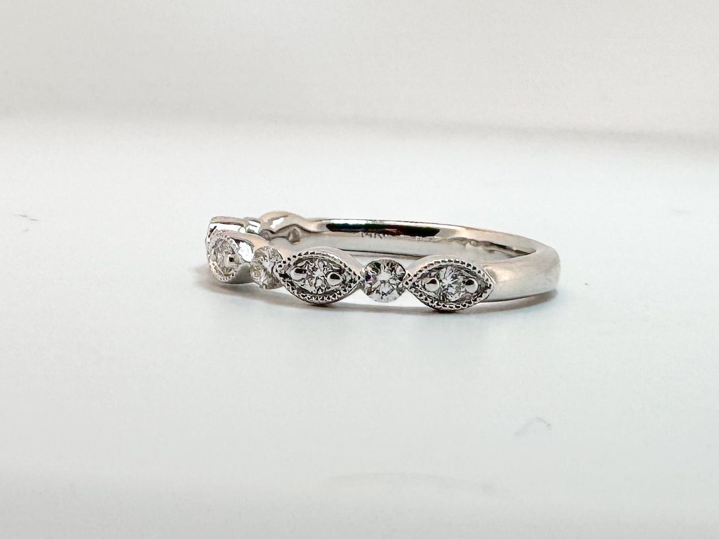 14K, White gold, .35 diamond total weight, scalloped band.
