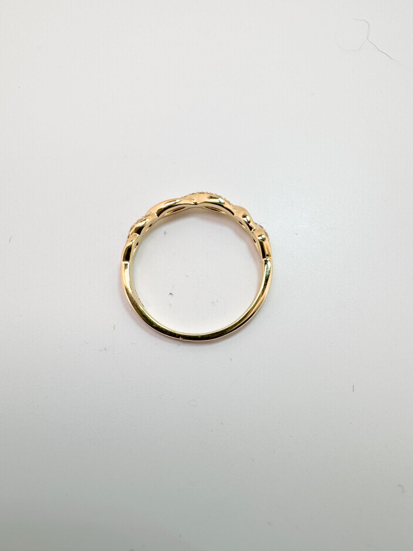 14K, Yellow gold, .14 diamond total weight, twisted wedding band.