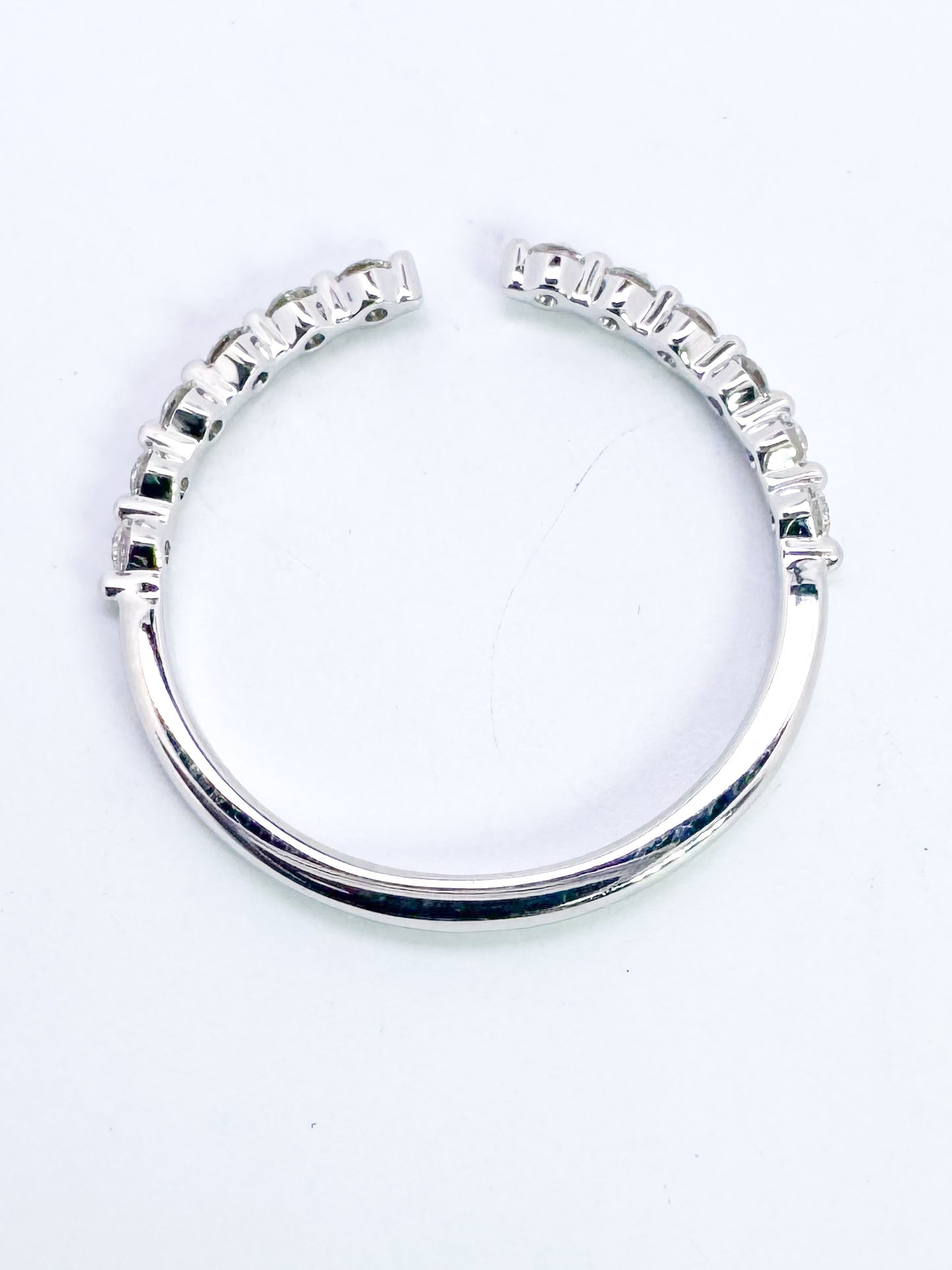 14K, White gold, open concept, natural diamond band. .24 carat total weight.