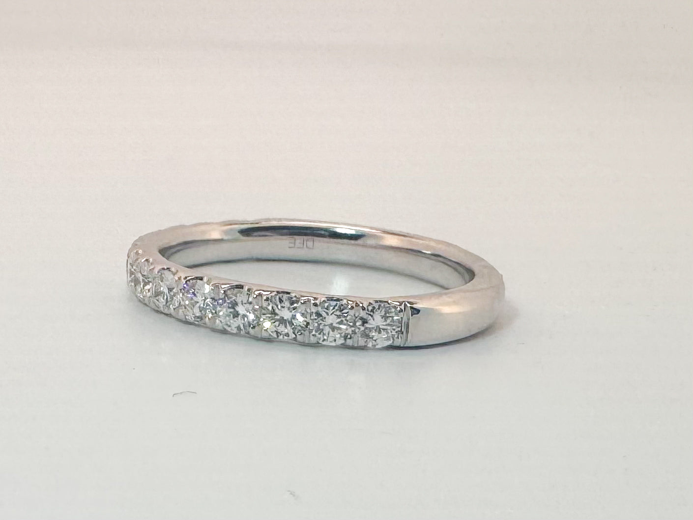 14k, White gold, .65 natural diamond wedding band. VS2 G