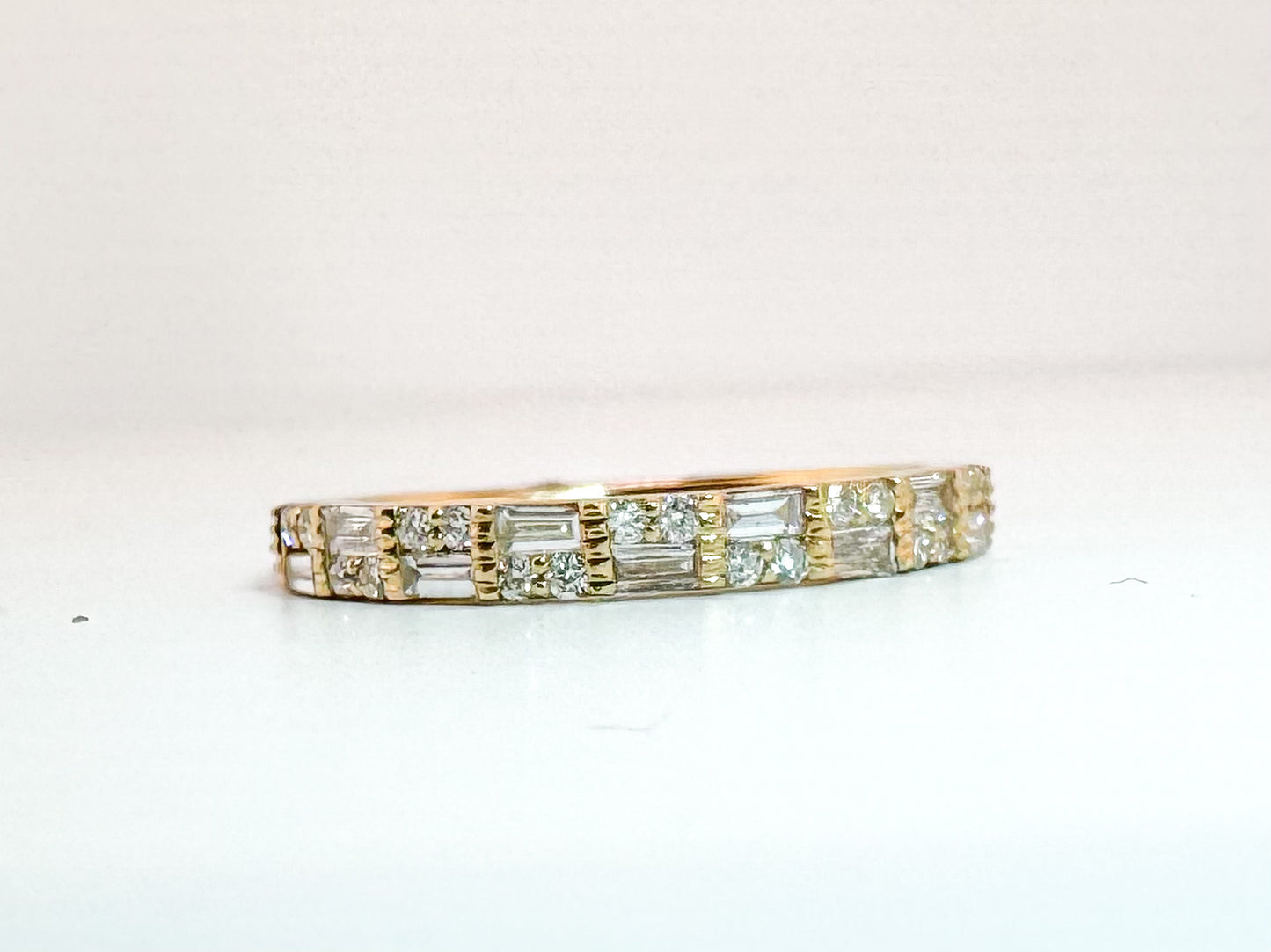 14K, Yellow gold, baguette and round brilliant natural diamond band. .43 ctw