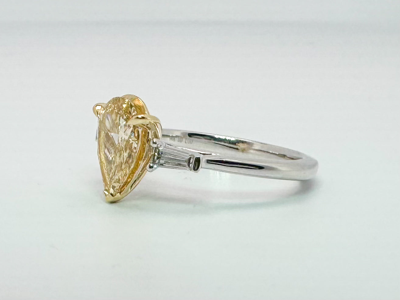 14K two tone, 1.54 pear shaped VS2 Fancy yellow lab grown diamond engagement ring.