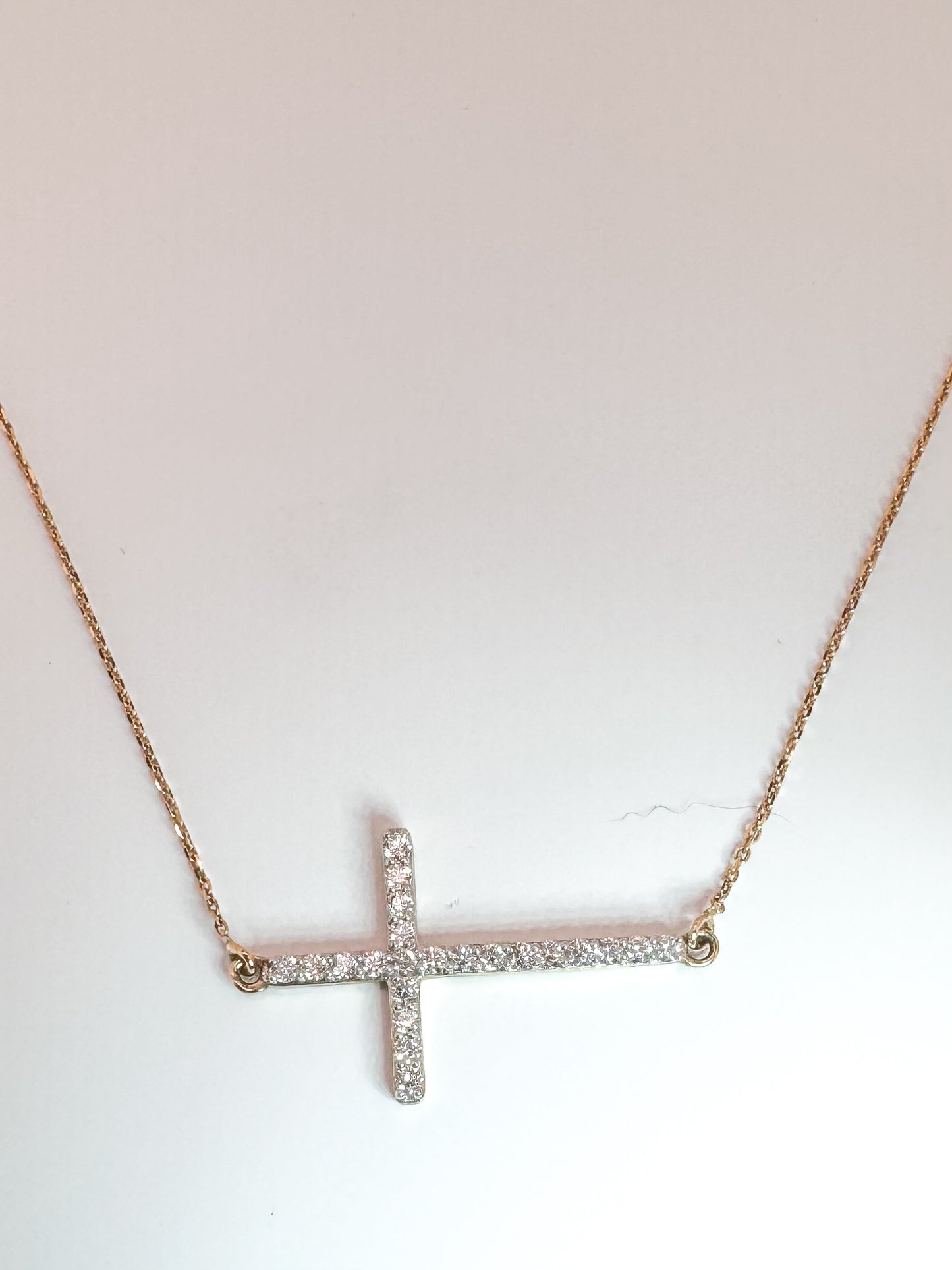 14K, Yellow gold, .56 carat total weight, sideways diamond cross.