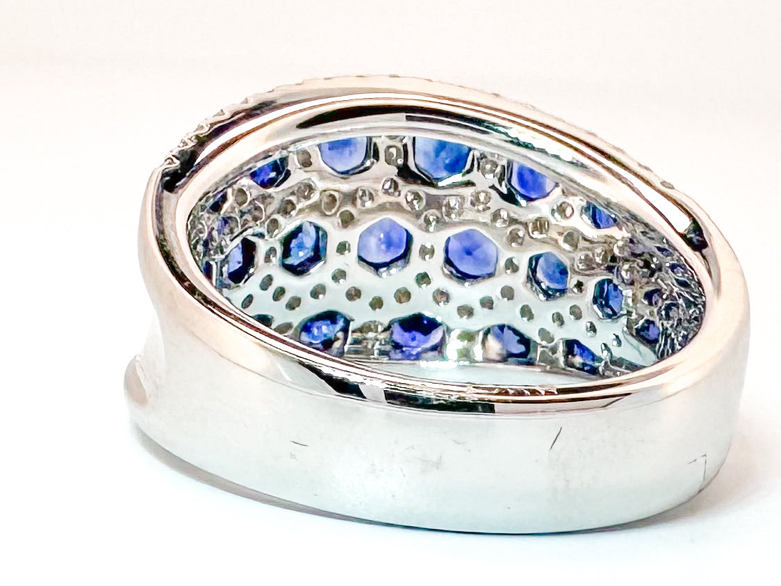 18k, white gold, 1.18 natural sapphire set with .62 carats of natural side diamonds.