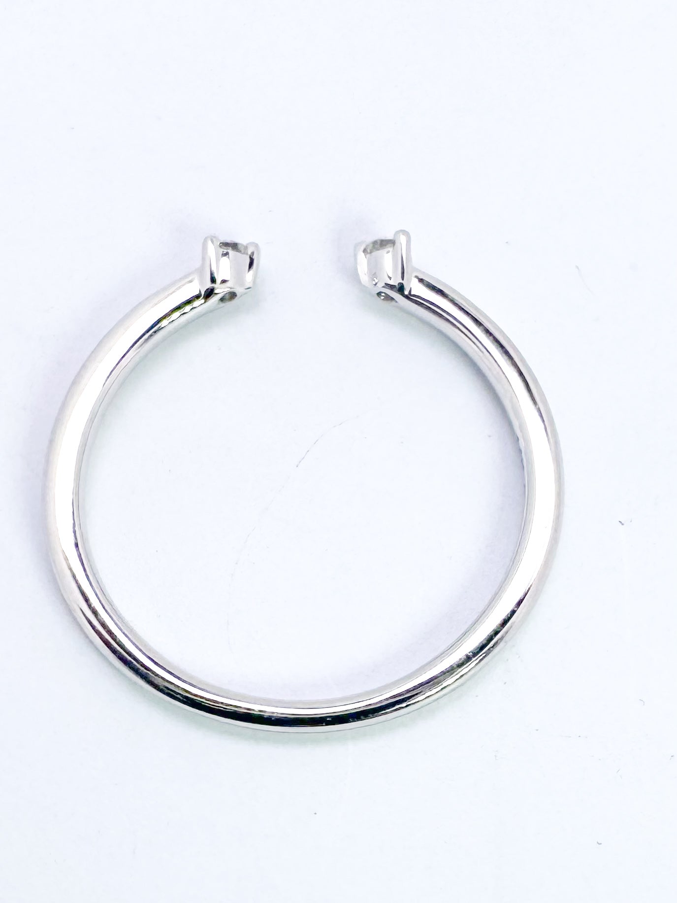 14k, white gold, .05 diamond total weight, open concept band.