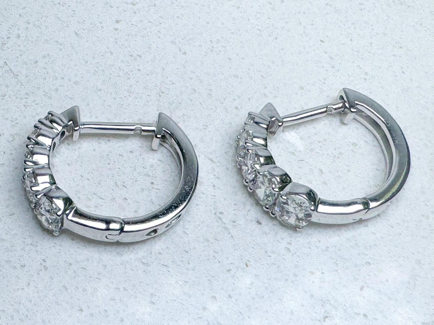 14k, white gold 1.30 diamond total weight earrings.