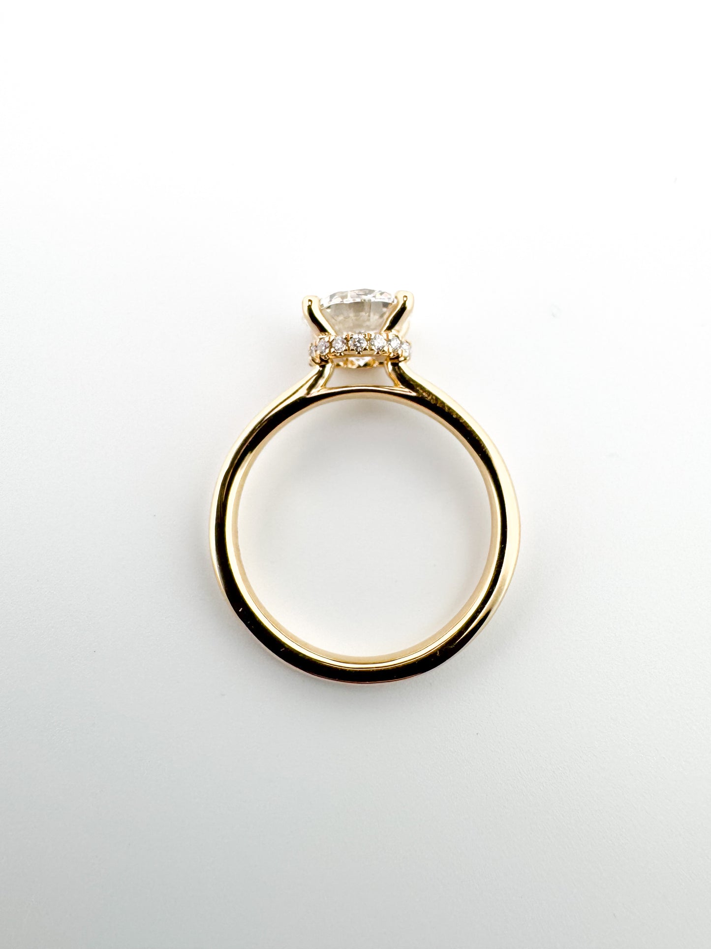 14K, Yellow gold, 2.06 lab grown round brilliant, set with .04 carats of side diamond. IGI CERTIFIED VS1 E