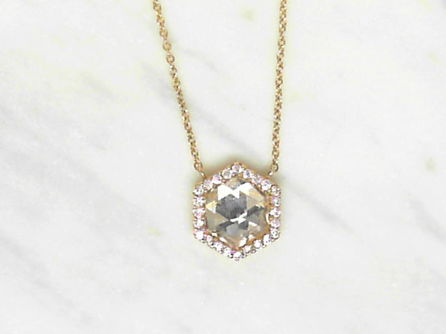 Hexagonal white quarta and diamond pendant.