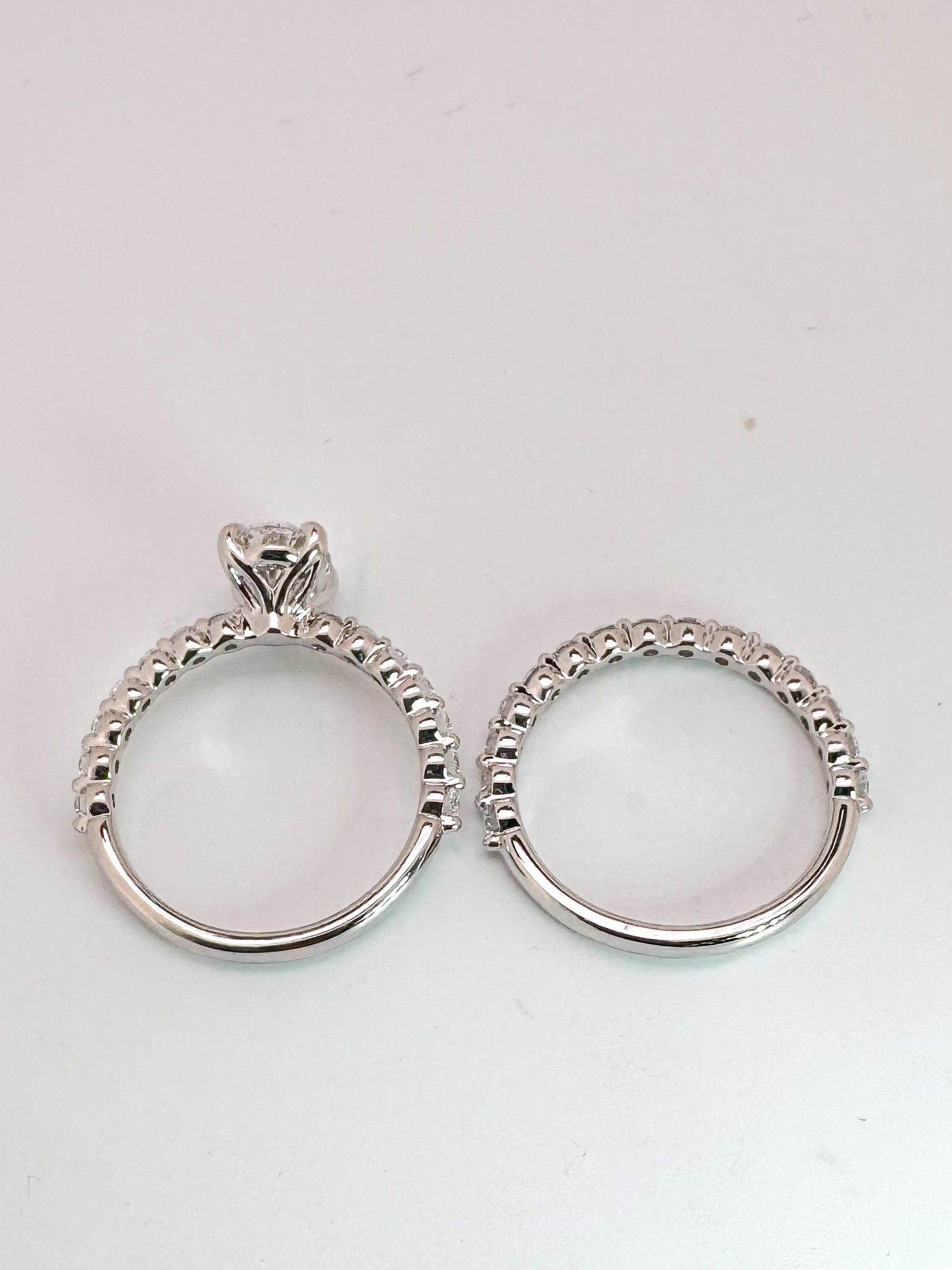 14k, white gold, 1.25 carat VS1 F, lab grown oval set with .75 carats of side diamonds. IGI certified.