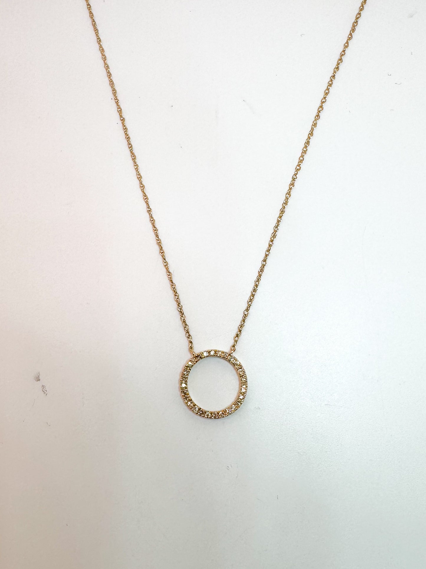 10K,Yellow gold, .10 diamond total weight, open circle pendant.