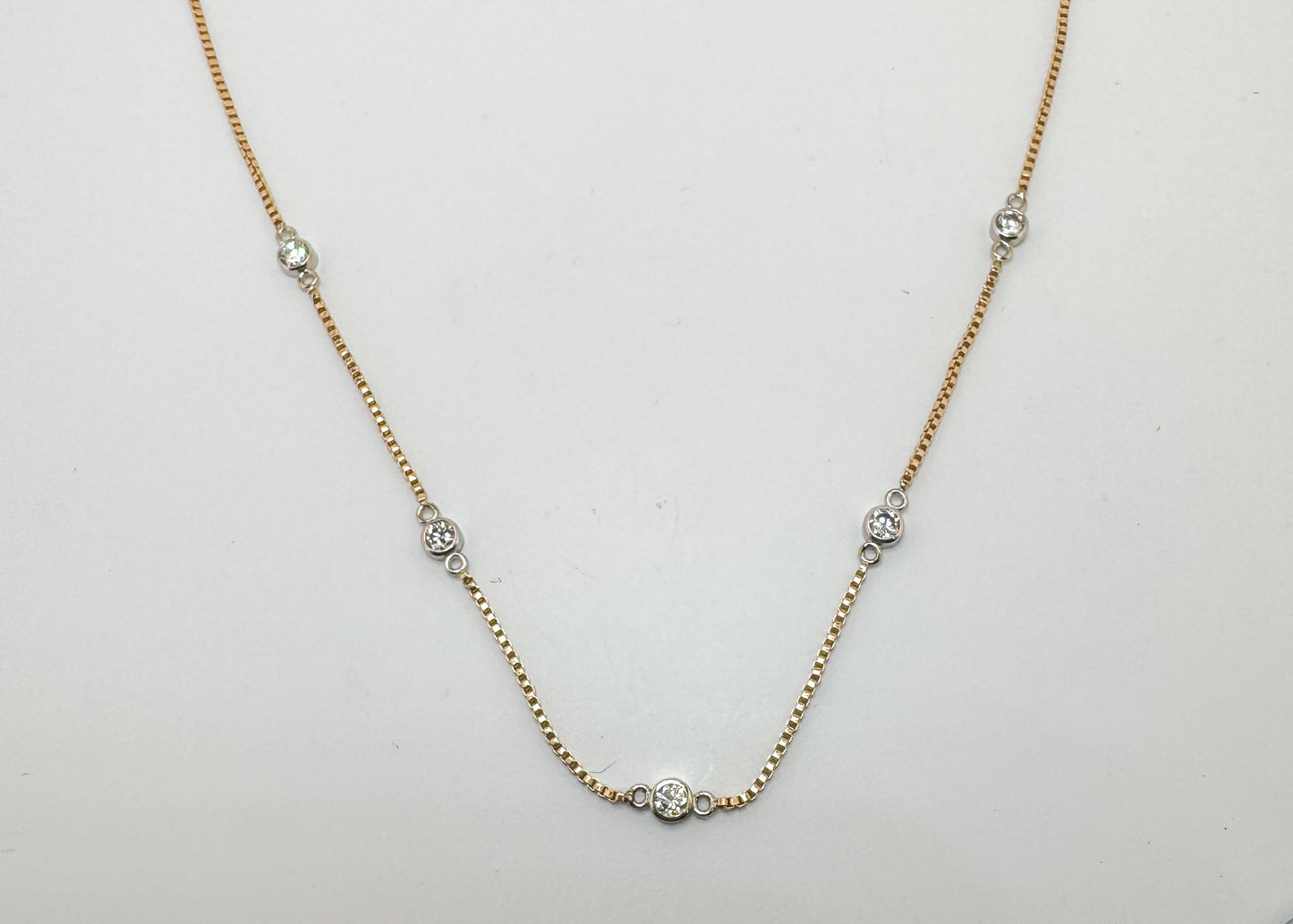 14k, two tone, .50 carat total weight, micro bezel diamond necklace.