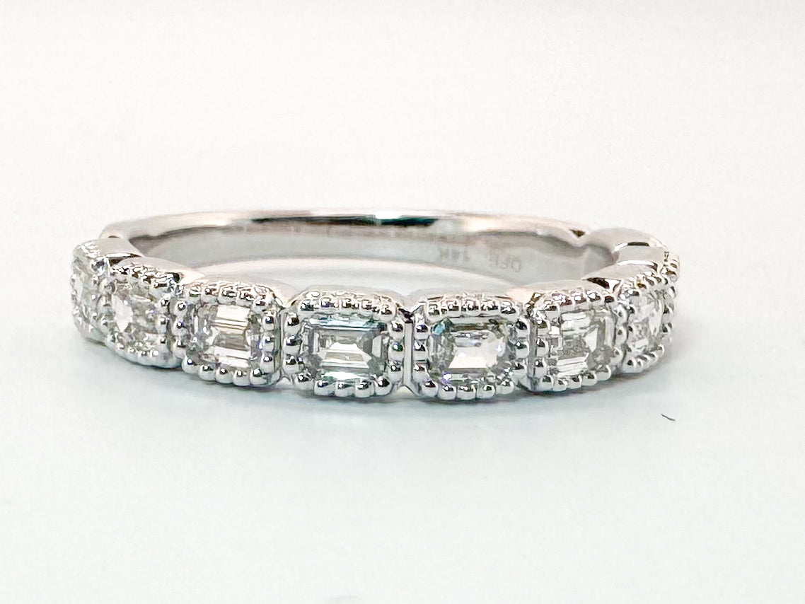 14K, White gold .75 carat. East/West, emerald cut natural diamonds VS G