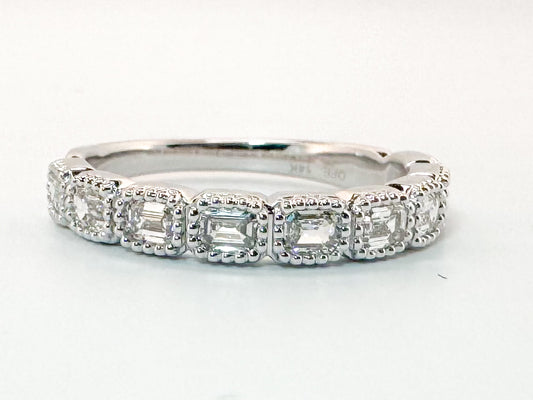 14K, White gold .75 carat. East/West, emerald cut natural diamonds VS G