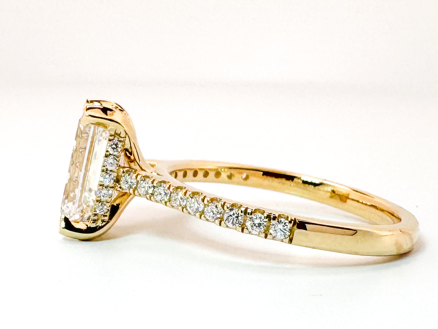 14K,Yellow gold 2.51 carat, Lab grown, emerald cut diamond set with .30 side diamonds. IGI Certitied VS1 E