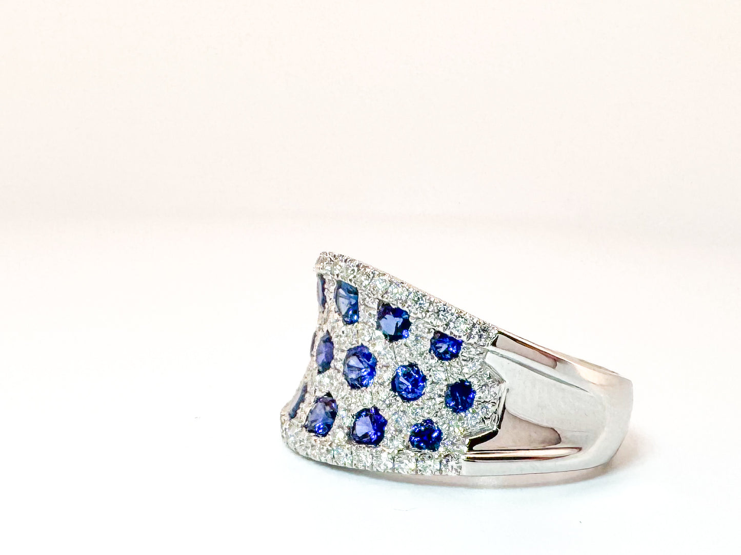 18k, white gold, 1.18 natural sapphire set with .62 carats of natural side diamonds.