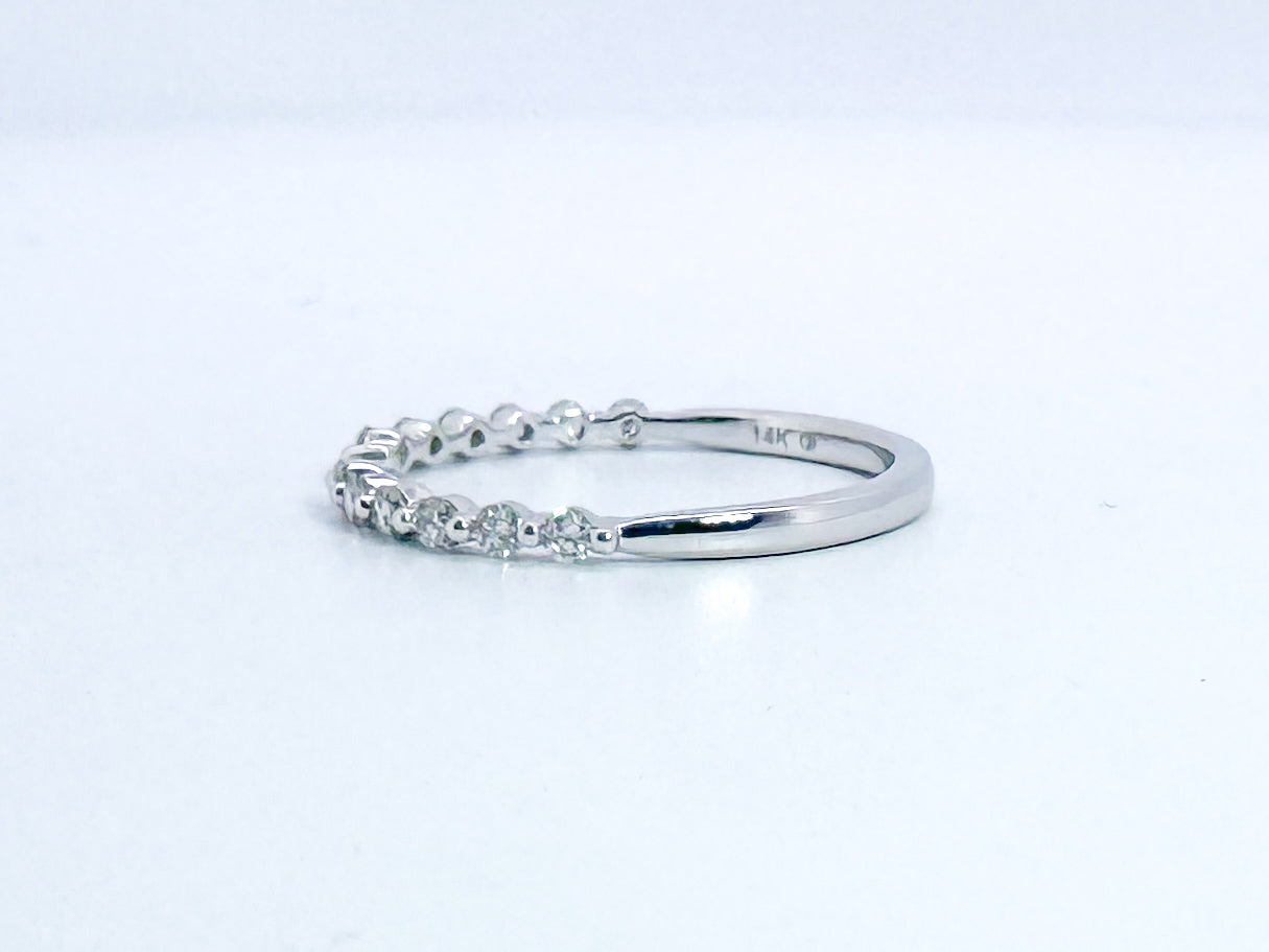 14K, White gold, open concept, natural diamond band. .24 carat total weight.