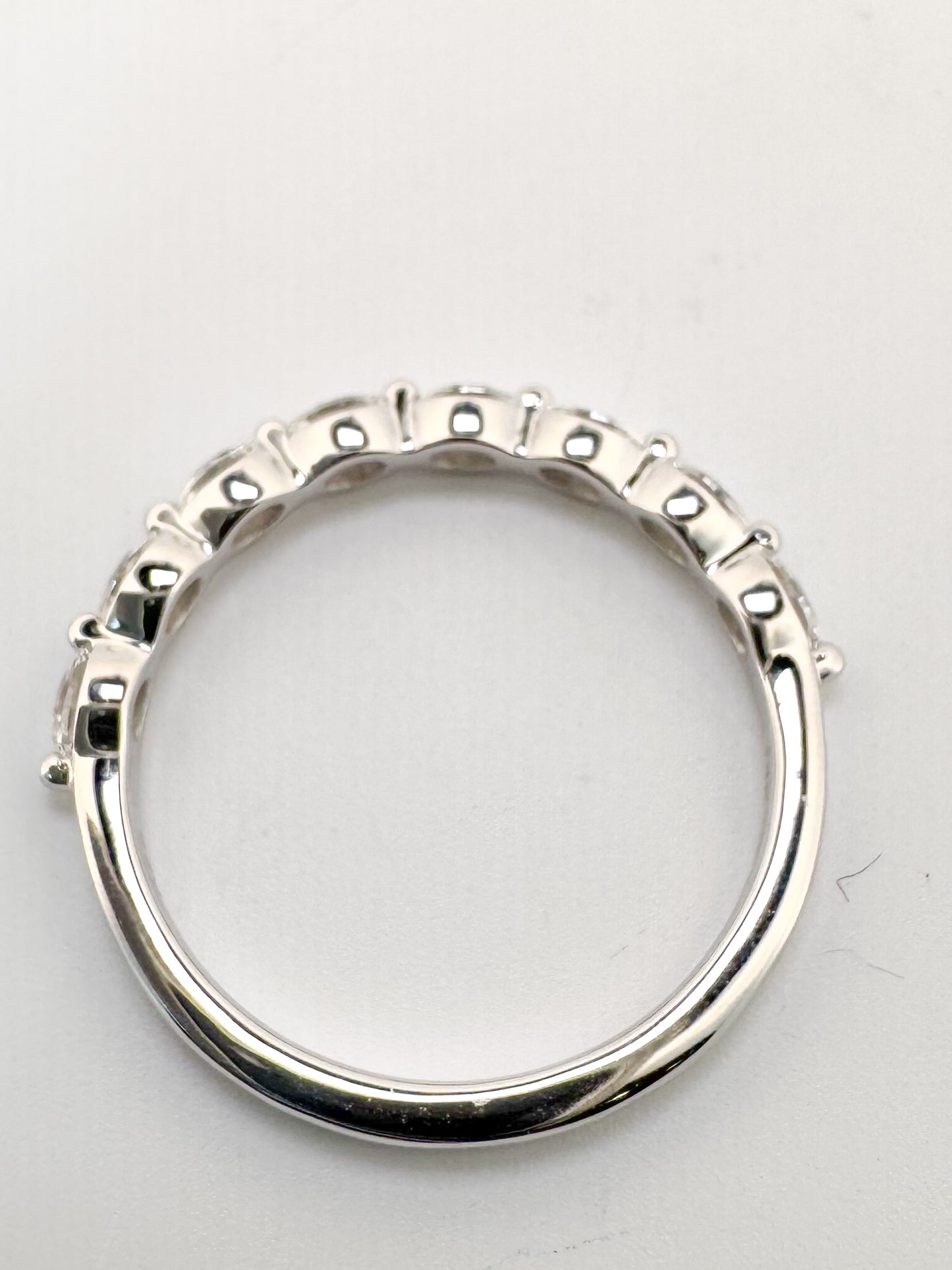 14K, White gold, .60 carat total weight, side ways oval band. VS2 G