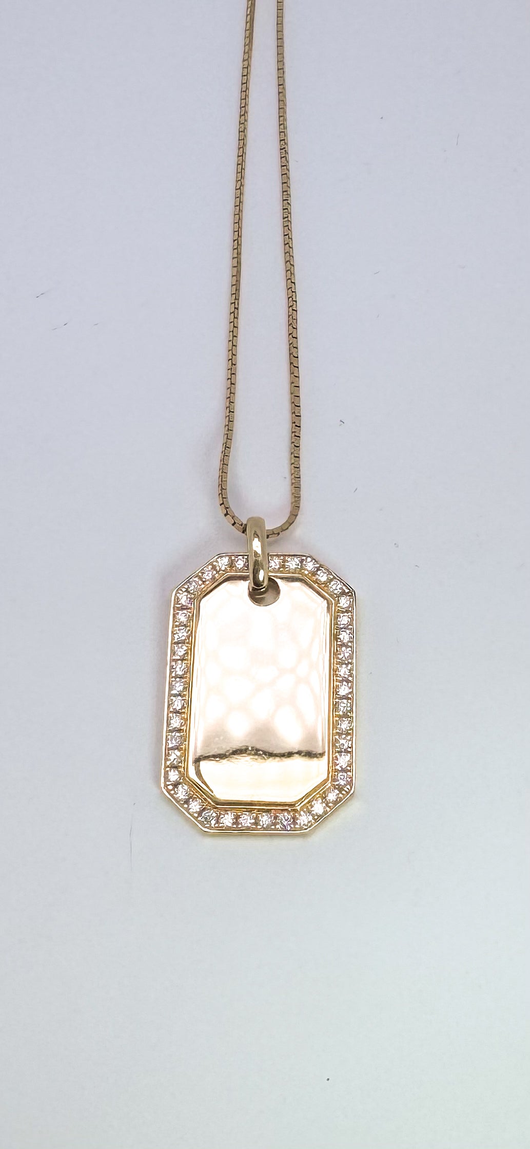 14k, yellow gold .83 diamond total weight, dog tag. Can be engraved