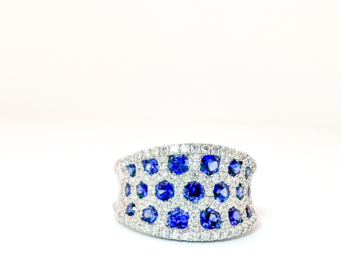 18k, white gold, 1.18 natural sapphire set with .62 carats of natural side diamonds.