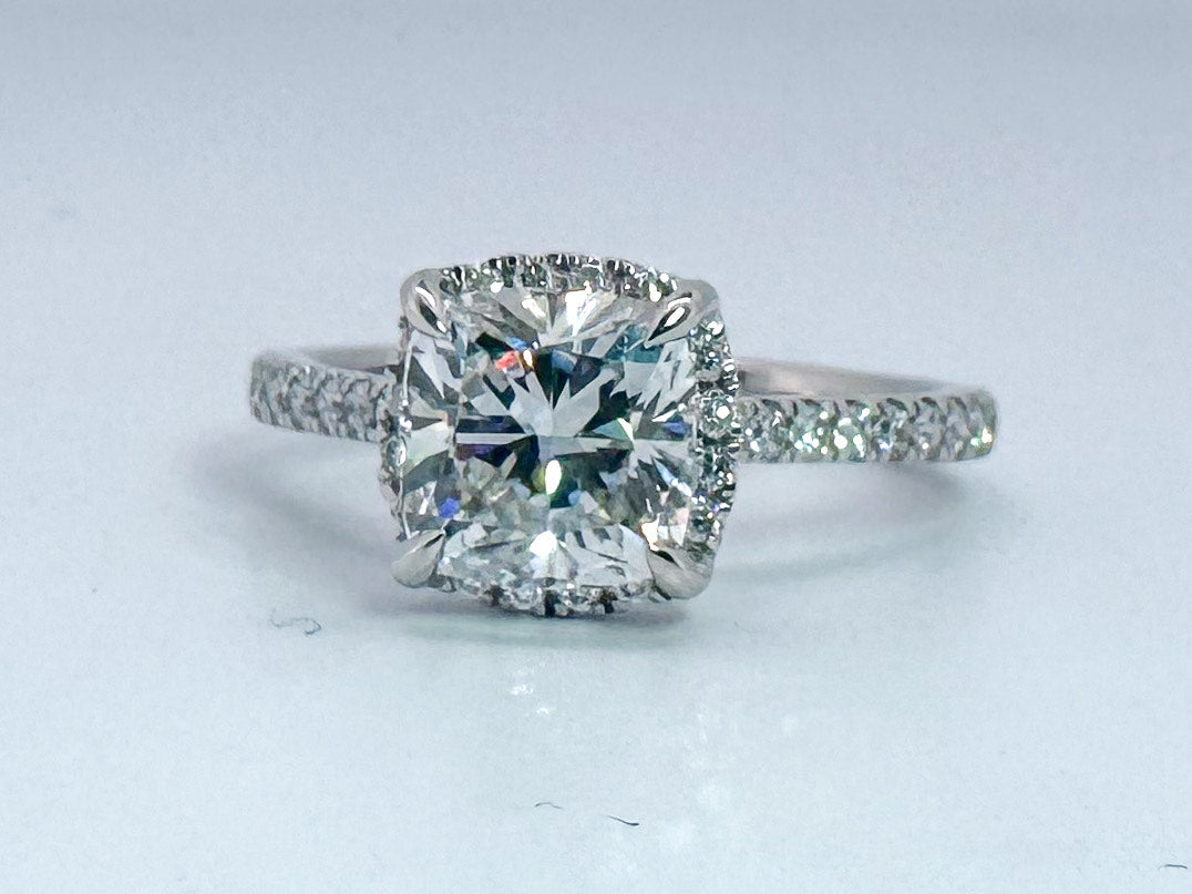 14kw 1.83 cushion cut center with .27 carats of side diamonds. Lab grown. IGI certified
