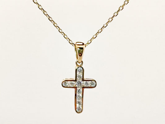 14k, yellow gold natural diamond cross. .29 carat total weight.