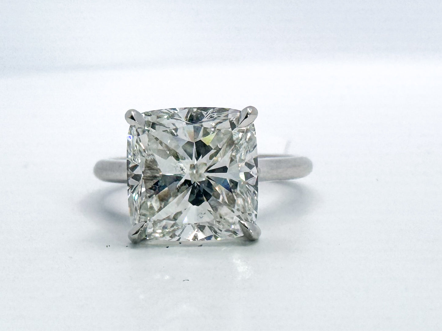Platinum 5.06 SI1 G Natural cushion cut diamond set in Platinum.