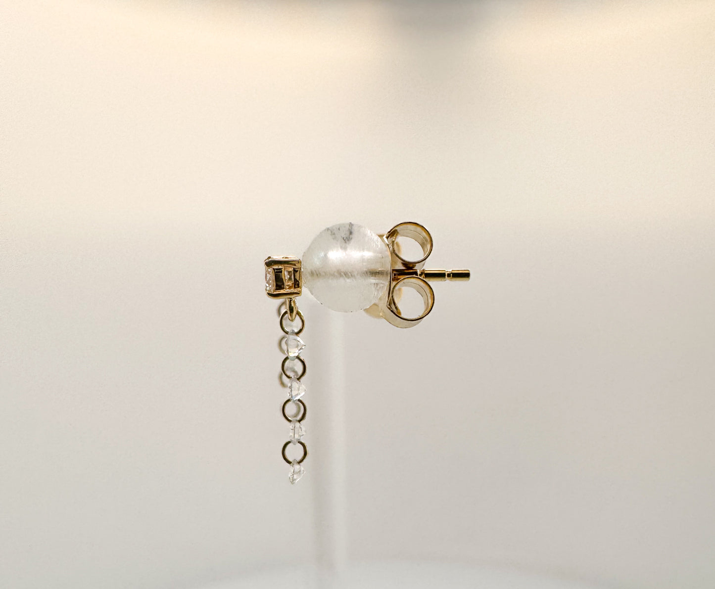 14ky .33 dtw drilled diamond dangle earrings.