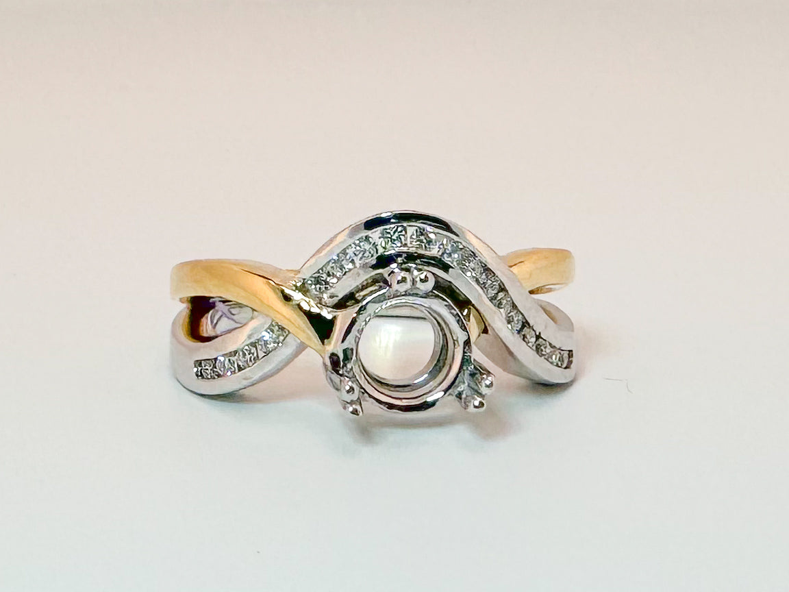 14K,two tone, .25 natural side diamond engagement mounting. Holds 1.00 carat round center stone