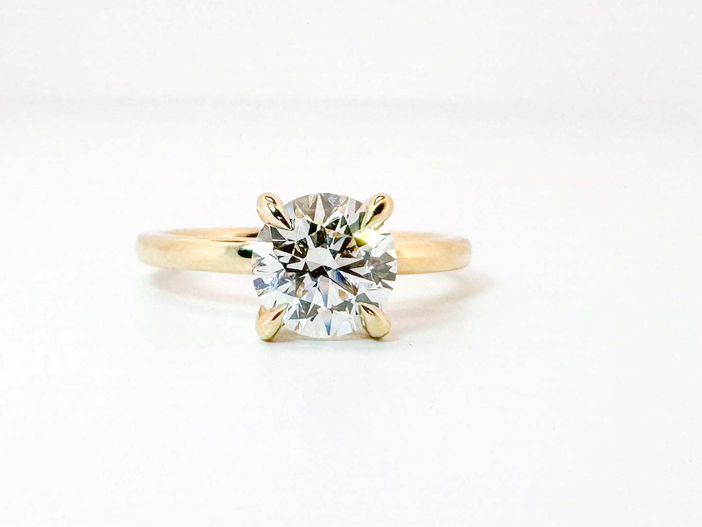 14k, Yellow gold , 1.59 E VS2 Ideall cut, lab grown, round brilliant  set with .07 side diamond halo. IGI Certified