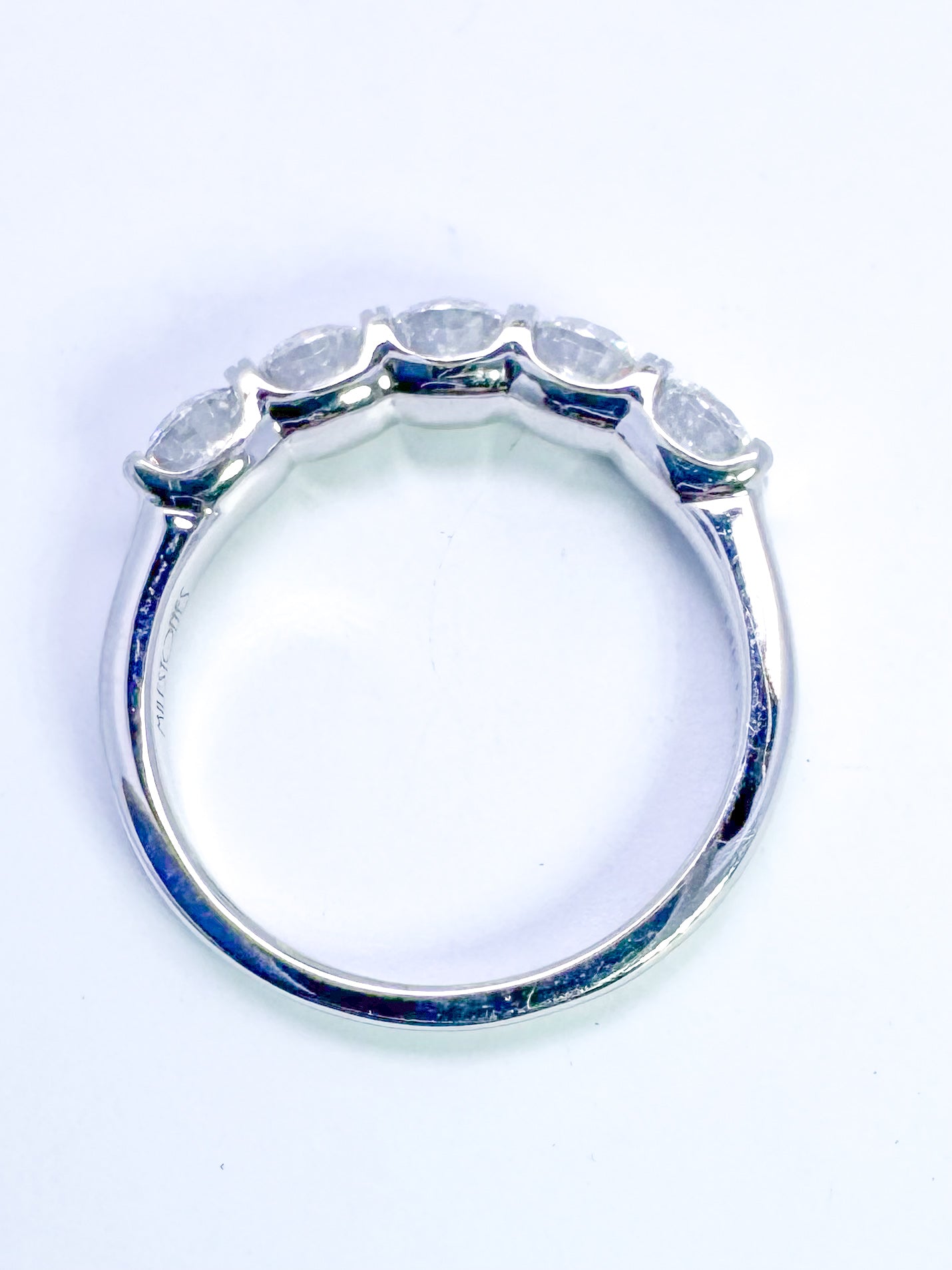 14K, white gold, 5 diamond band 1.50 diamond total weight. Lab grown